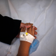 Cancer patient and blind Palestinian girl Aseel al-Haj Ahmed, 9, holds her mother's hand as she receives a regular treatment in a hospital in Gaza City